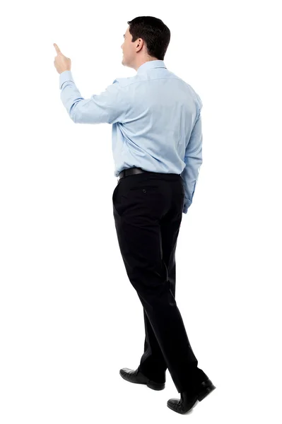 Back view of a middle aged man pointing finger — Stock Photo, Image