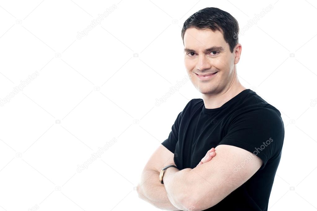 Smiling man with folded arms