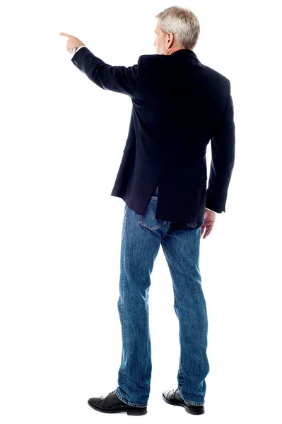 Businessman pointing at copy space — Stock Photo, Image