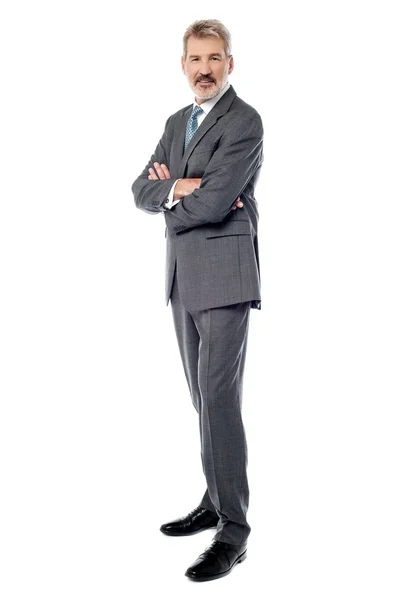 Confident businessman with arms crossed — Stock Photo, Image