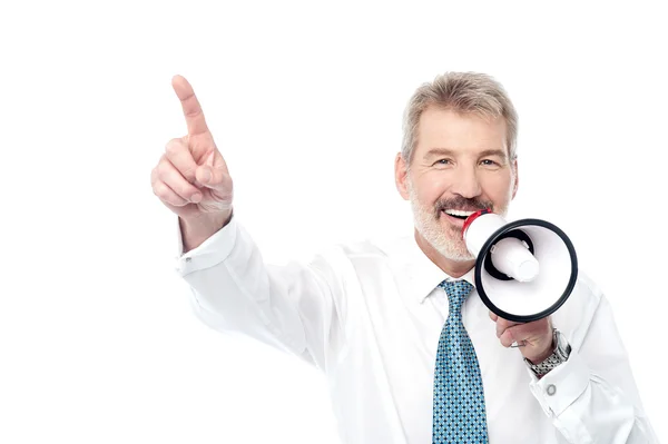 Businessman making an announcement by megaphone — Stock Photo, Image