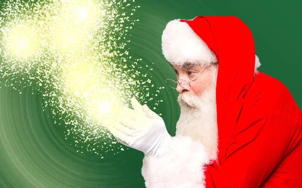 Santa holding sihirli ışıkları — Stok fotoğraf