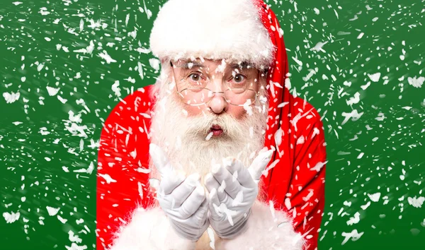 Santa claus blowing snow — Stock Photo, Image