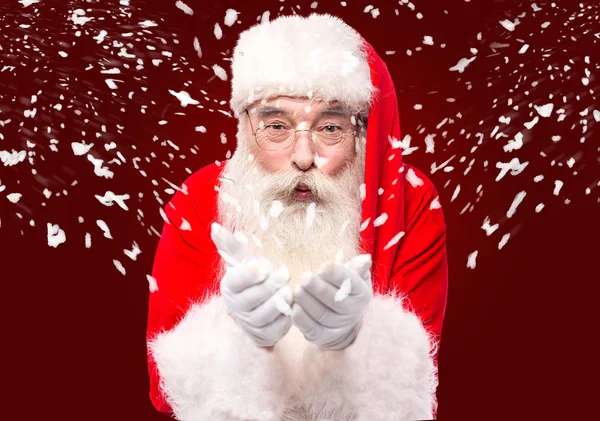 Santa Claus blowing  snow — Stock Photo, Image