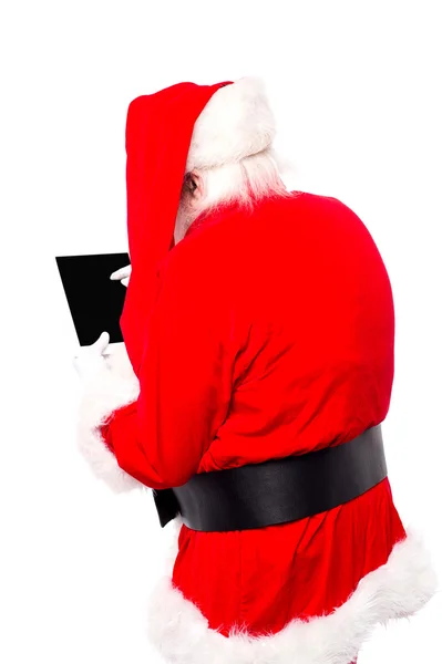 Weihnachtsmann mit Tablet — Stockfoto