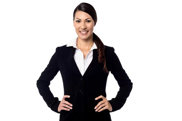 Female executive with hand on her waist — Stock Photo, Image