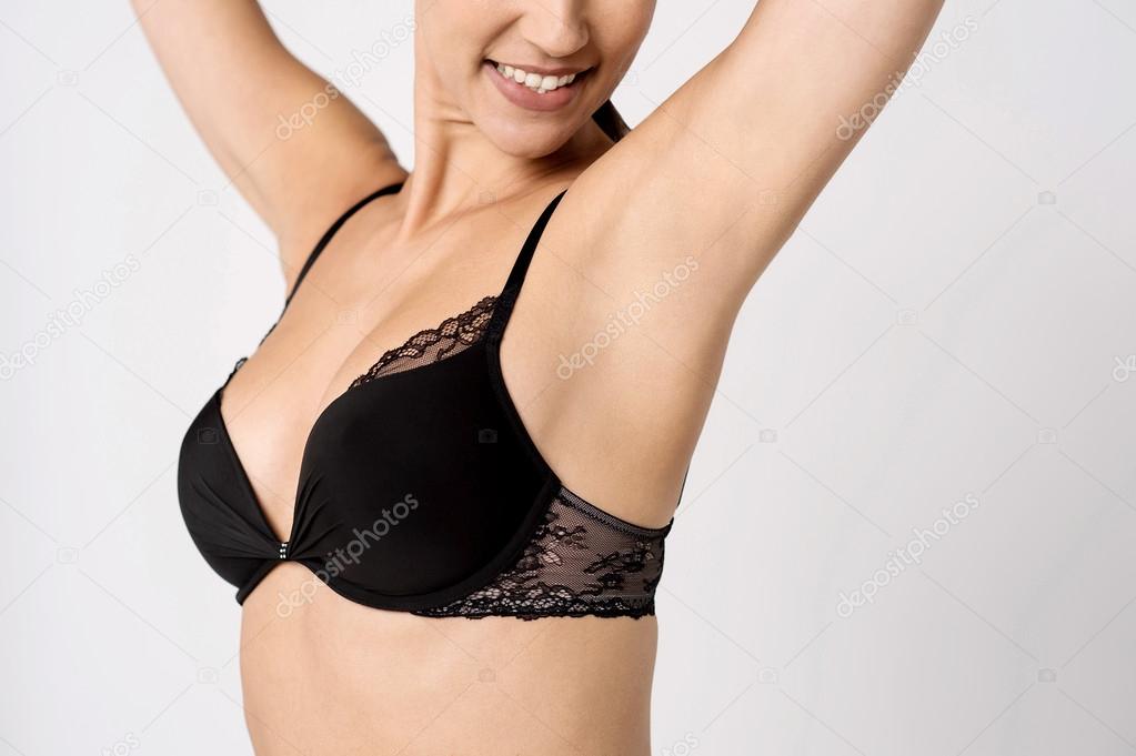 Woman in designer bra posing