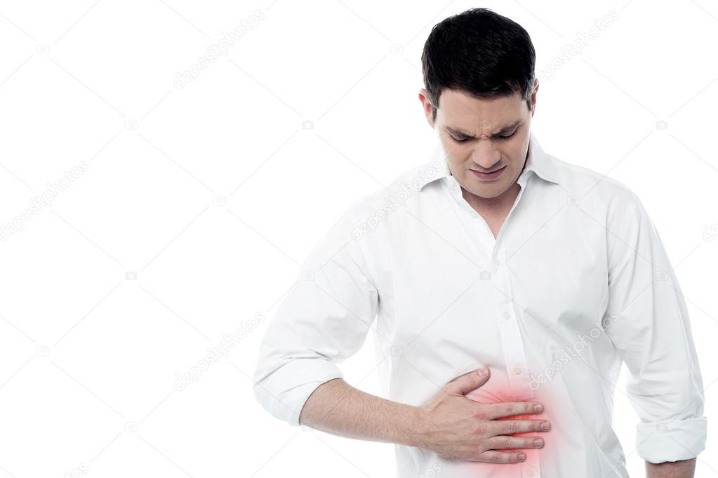 Young man with strong stomach pain