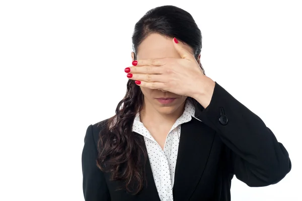 Woman covering her eyes with hand — Stock Photo, Image