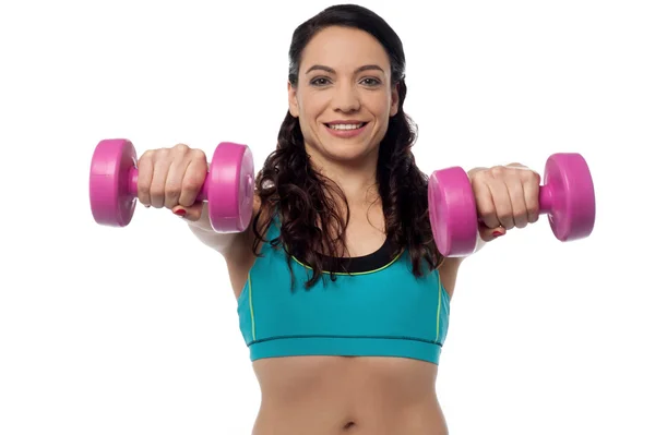 Fitness woman lifting dumbbells — Stock Photo, Image