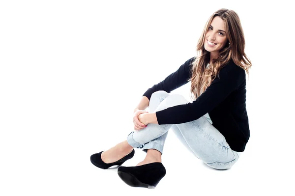 Relaxed girl sitting on floor — Stock Photo, Image