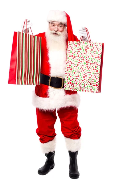 Санта Клаус покупает подарки — стоковое фото