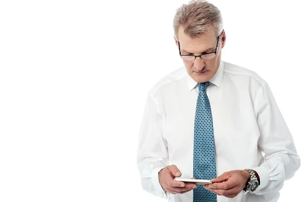 Businessman operating mobile phone — Stock Photo, Image