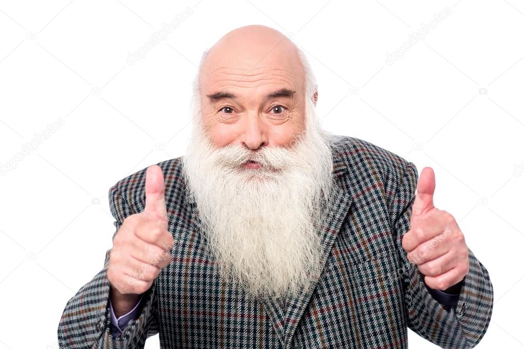 Senior male giving thumbs up