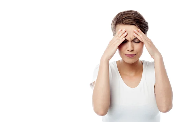 Woman touching her forehead — Stock Photo, Image