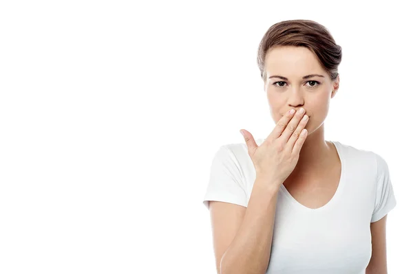 Woman covering her mouth Stock Picture