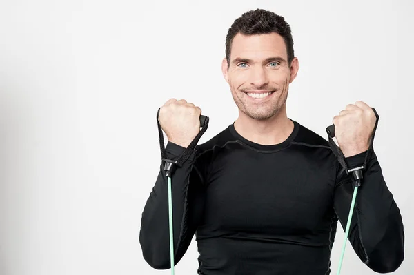 Athlete with stretch band — Stock Photo, Image