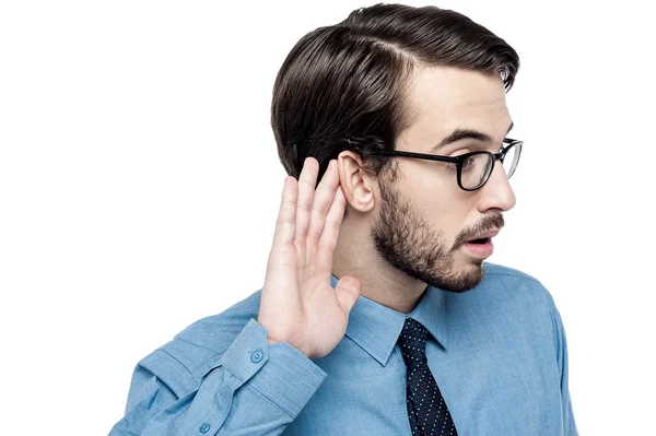 Businessman listening to conversation — Stock Photo, Image