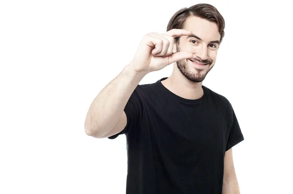 Man showing small amount gesture — Stock Photo, Image