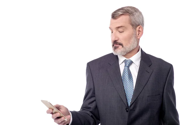 Businessman looking his mobile phone — Stock Photo, Image