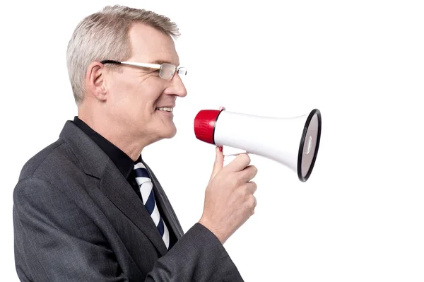 Businessman talking on megaphone — Stock Photo, Image