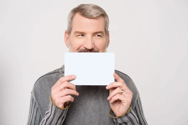 Man holding up business card — Stock Photo, Image