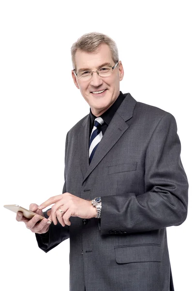 Entrepreneur holding a mobile phone — Stock Photo, Image