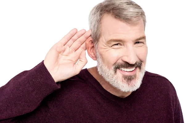 Man cupping hand behind ear — Stock Photo, Image