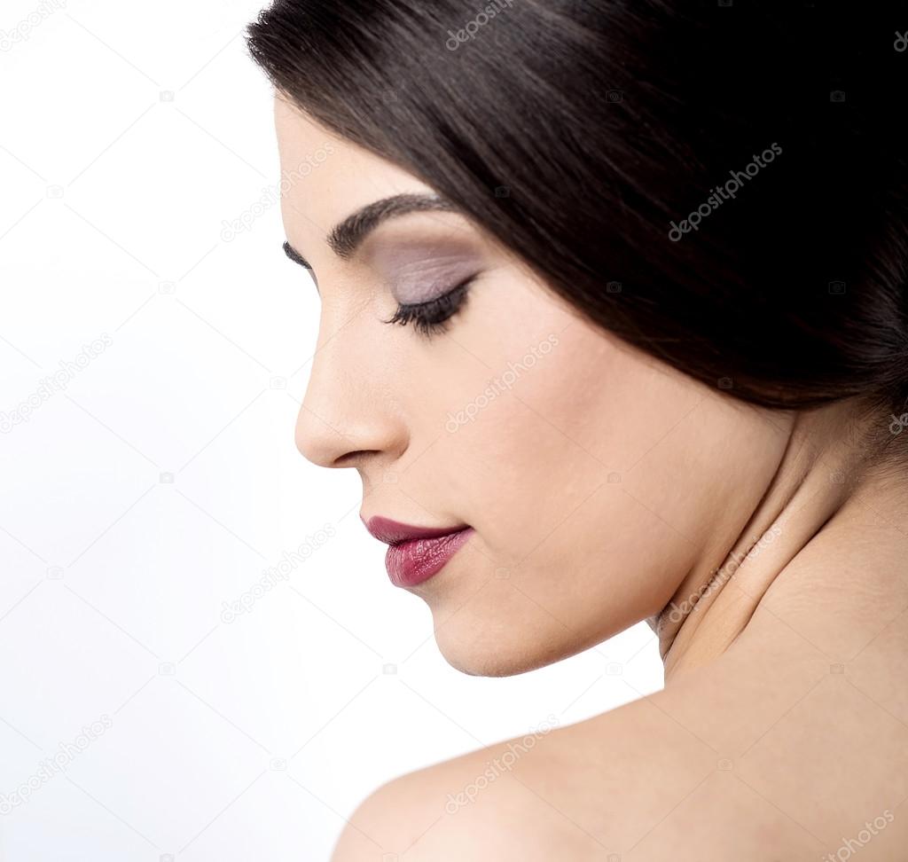 Woman with closed eyes and evening makeup