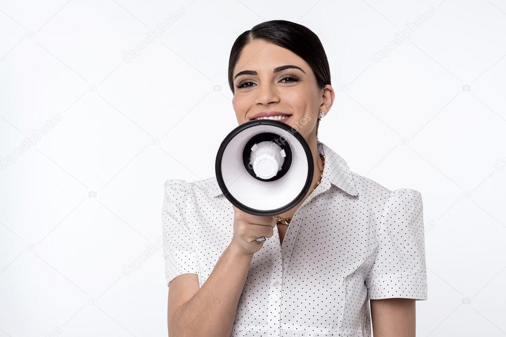 Woman proclaiming into megaphone