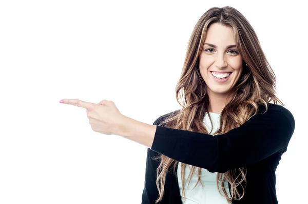 Woman pointing to copy space — Stock Photo, Image