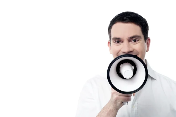 Man proclaiming into loudspeaker — Stock Photo, Image