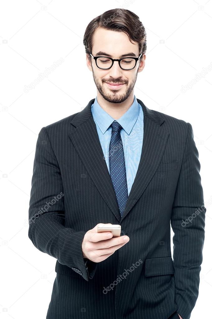 Businessman sending message