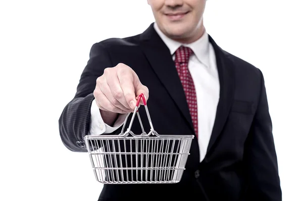 Businessman showing shopping cart — Stock Photo, Image