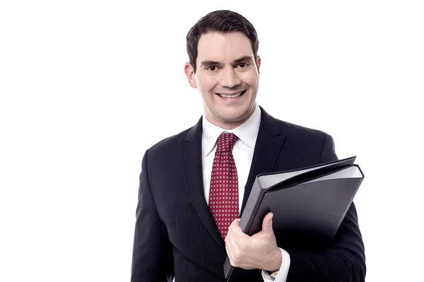 Businessman holding a black folder — Stock Photo, Image