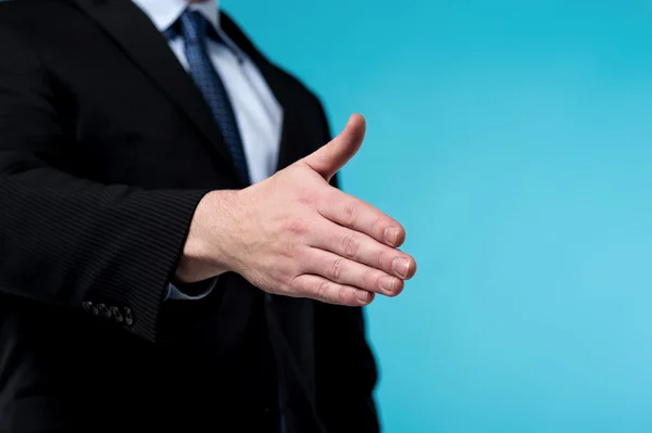 Businessman extending hand to shake — Stock Photo, Image