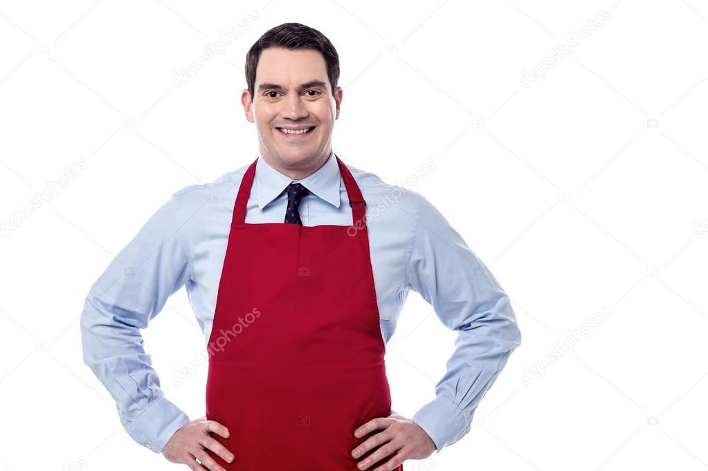 Male chef with hands on waist