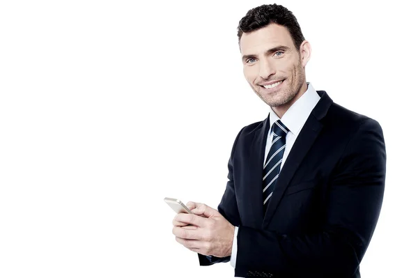 Businessman operating his mobile phone — Stock Photo, Image