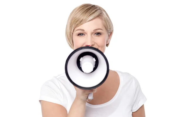 Woman proclaiming into megaphone — Stock Photo, Image