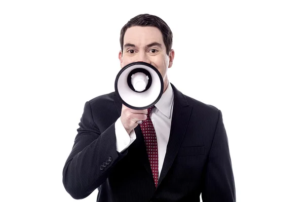 Businessman talking on a megaphone — Stock Photo, Image