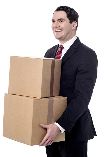 Businessman carrying boxes — Stock Photo, Image