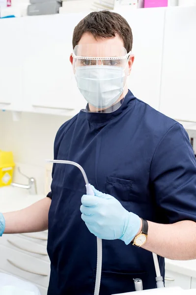 Dentist with dental cleaning tools — Stock Photo, Image