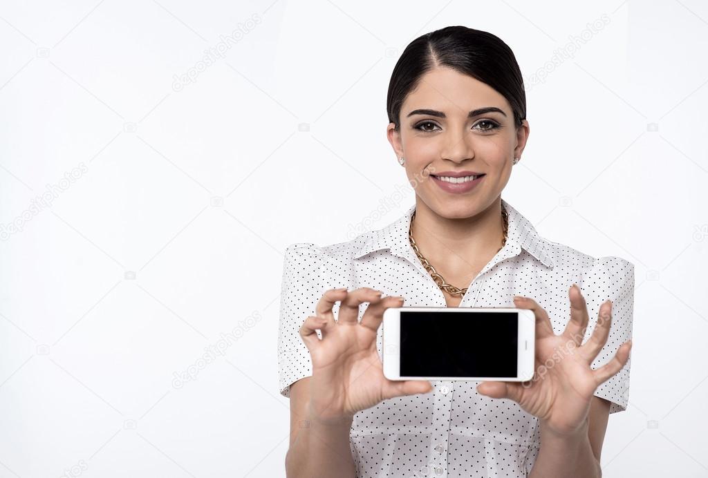 Woman showing blank mobile screen