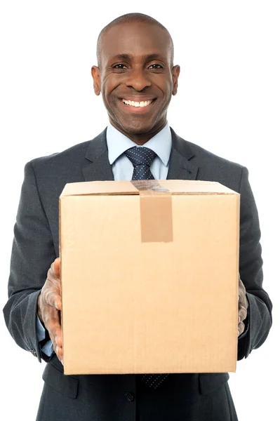 Businessman holding carton box — Stock Photo, Image