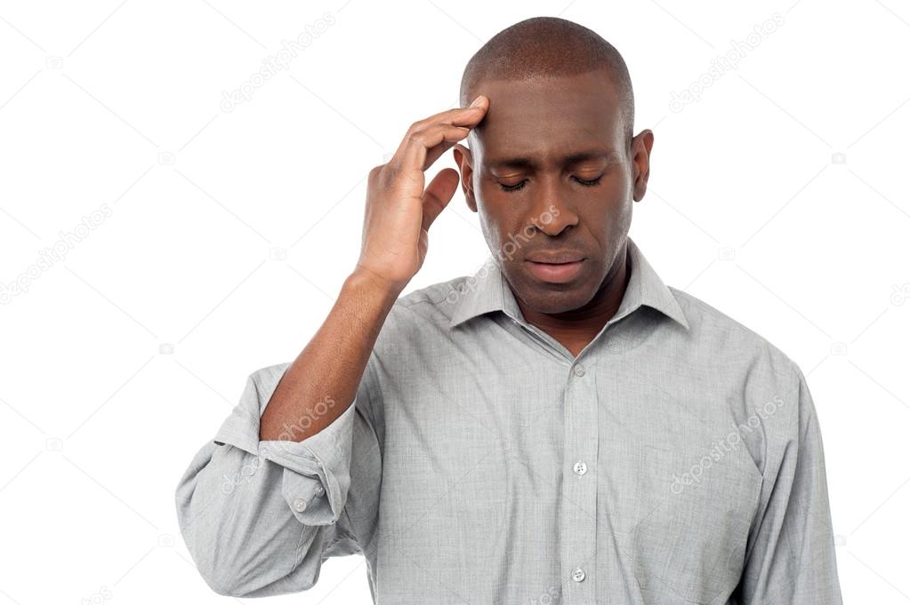 African guy suffering from headache