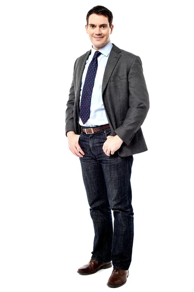 Businessman with hands in pockets — Stock Photo, Image