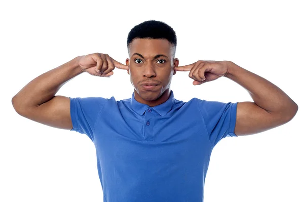 Man covering ears with hands — Stock Photo, Image