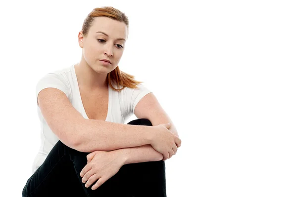 Woman looking thoughtful about troubles — Stock Photo, Image