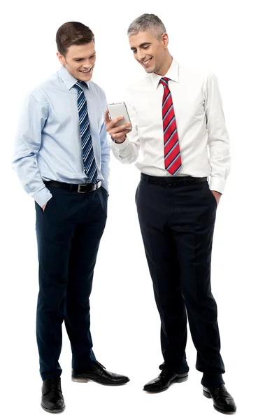 Business executives using smart phone — Stock Photo, Image