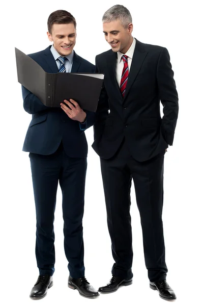 Business people reviewing reports — Stock Photo, Image